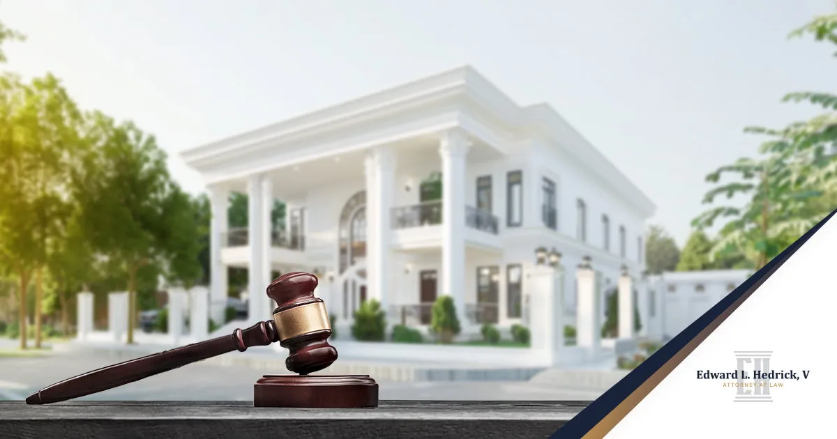 Home Buyer Reviewing A Title Report With A Lawyer Before Closing In North Carolina | A wooden judge’s gavel rests on a desk before a luxurious white mansion, with attorney Edward L. Hedrick branding in the corner.